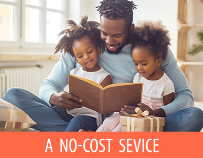 dad reading to toddler girls