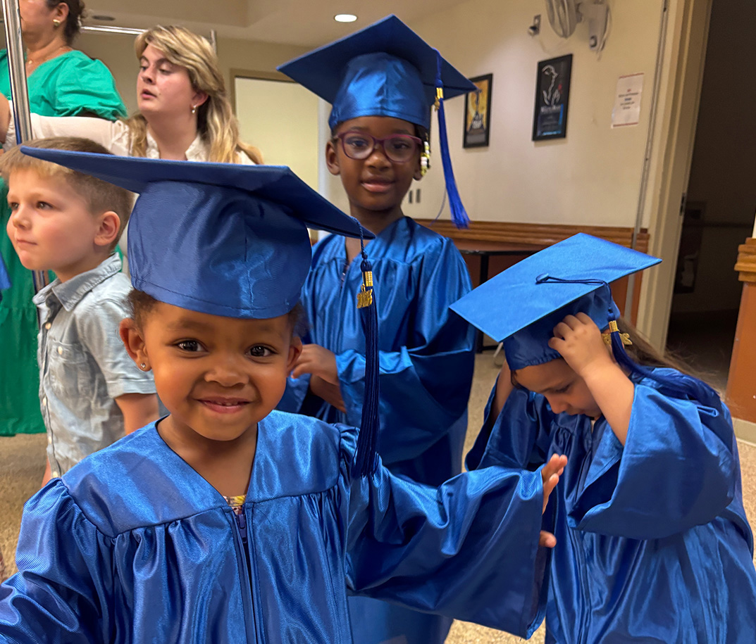 Our little scholars in cap and gown